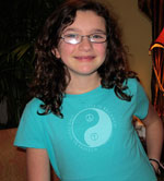 Mackenie wearing a Life is Balance Peace Tee for girls